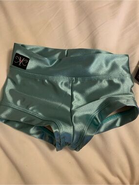 Kandi Kouture shimmering jade dance shorts Size Child medium CS 5/6 new